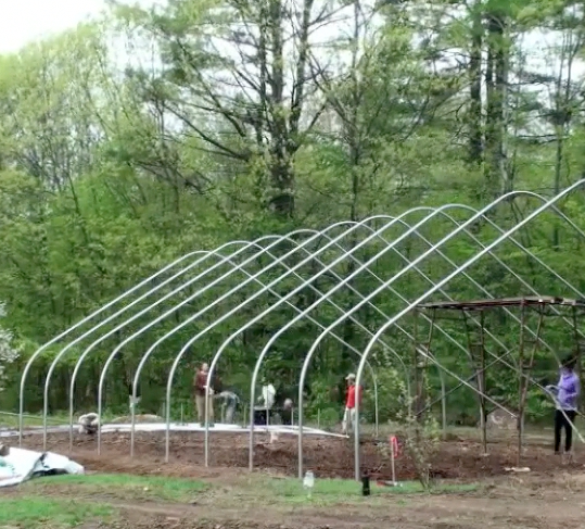 Raising The Hoop House In 90 Seconds